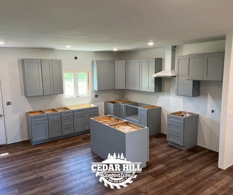 Cabinet installation in Salisbury, MO: gray shaker cabinets and a center island