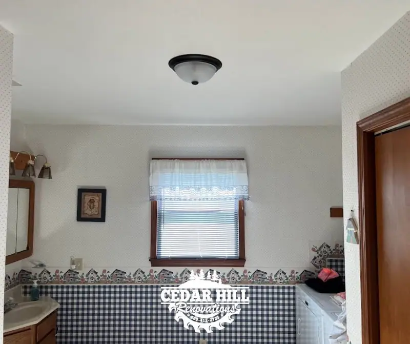 Popcorn ceiling removal in Bynumville, MO, after: smooth ceiling and new light fixture