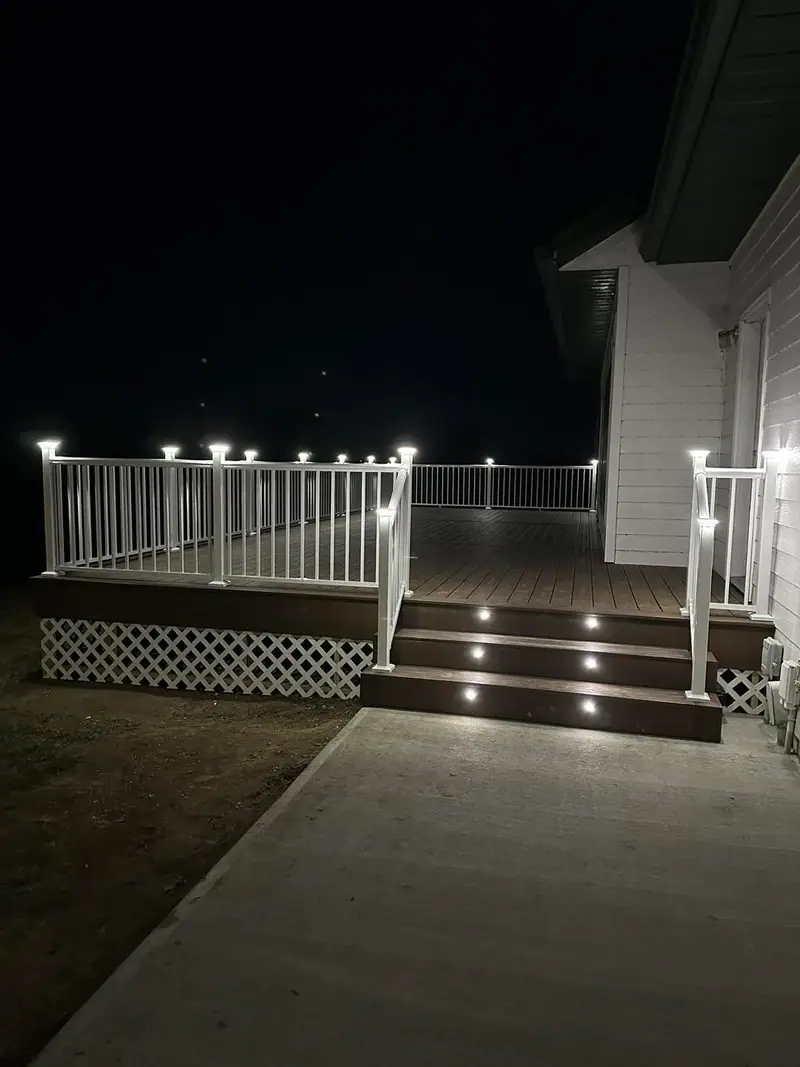 Deck stairs with built-in step lights at night in Salisbury, MO