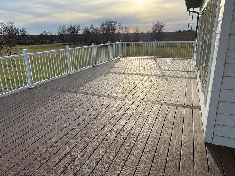 Composite deck with white railings at sunset in Salisbury, MO