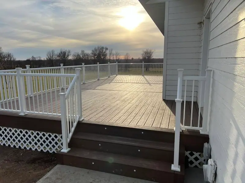 Composite deck stairs and white railings in Salisbury, MO