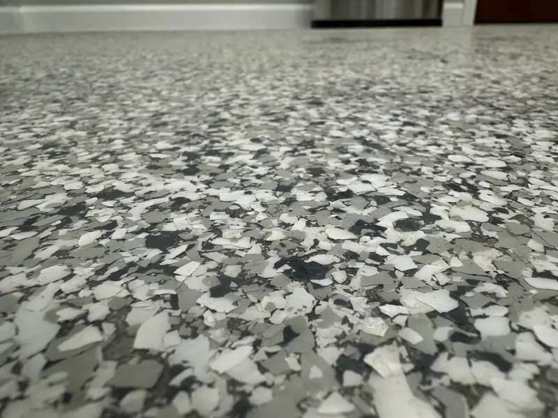 Close-up of a polyaspartic flake floor installed in Keytesville, MO