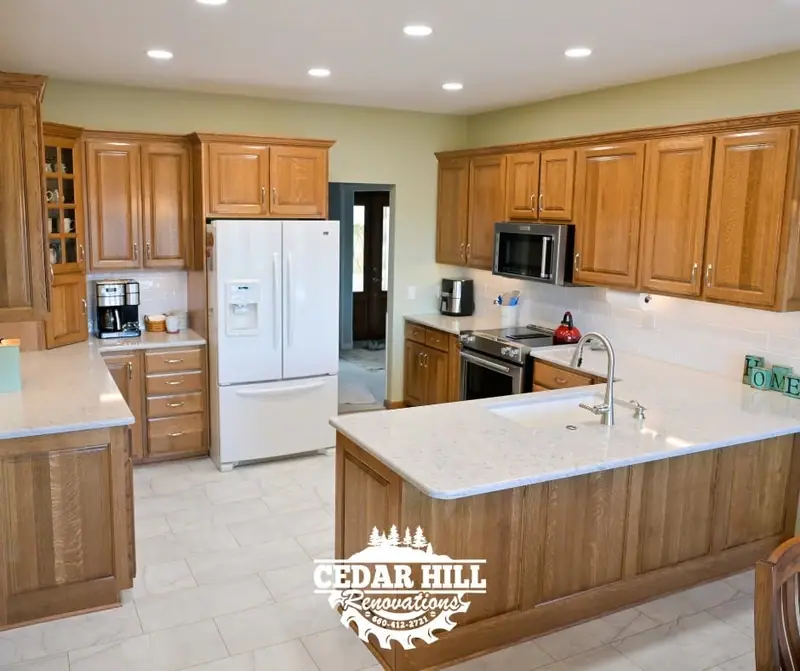 Kitchen remodel in Keytesville, MO, after: quartz countertops, subway tile backsplash, and tile floors