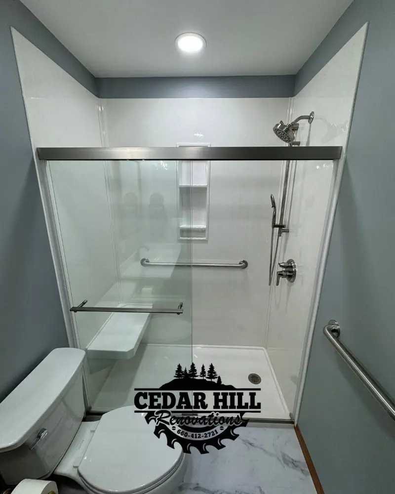 Tub-to-shower conversion in Salisbury, MO, after: walk-in shower with grab bars and seat